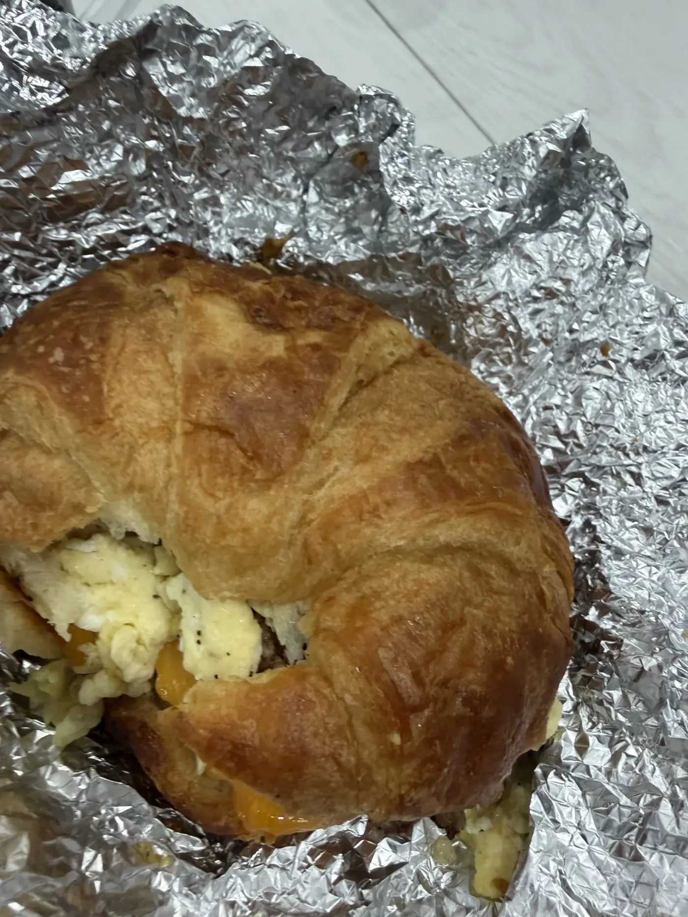 A breakfast croissant sandwich from Oak's kitchen
