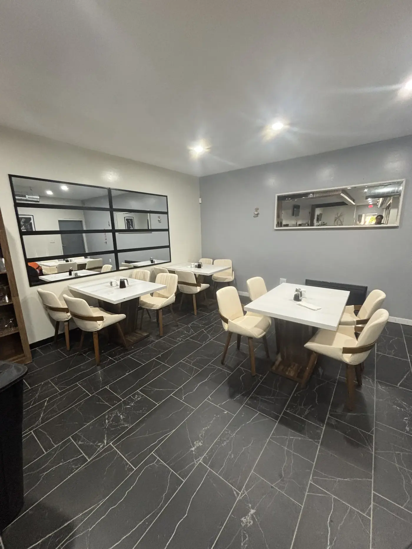 Café tables and chairs in Oak's dining room